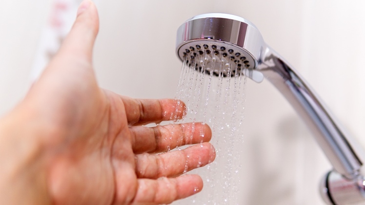How do water-efficient shower heads work?